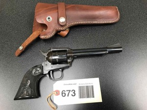 lot 673 image: Pistol  Colt New Frontier .22 wholster (SN G149091) 