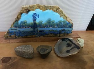 lot 232 image: Painted rocks windmill with bluebonnets, farmhouse with windmill nightlight, 2 rocks