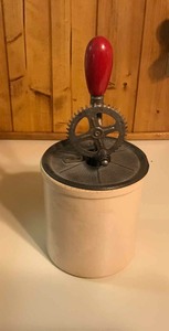 lot 240 image: Antique A& J Hand Mixer on small crock