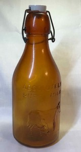 lot 258 image: Absolutely pure milk brown bottle