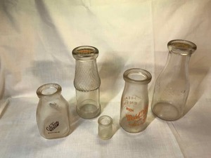 lot 260 image: Assorted milkcream bottles