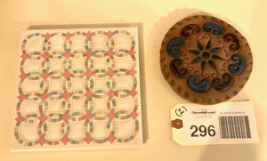 lot 296 image: Decorative tile double wedding ring, painted pottery wall hanging