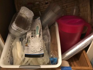 lot 304 image: Foil pans, cling wrap, Reynolds wrap, plastic utensils, plastic water pitcher