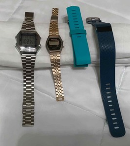 lot 379 image: (2) digital watches, a fitness type watch, band for fitbit