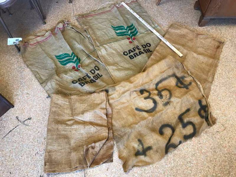 lot 30 image: (2) Cafe Do Brasil Burlap Bags & Pieces of Burlap