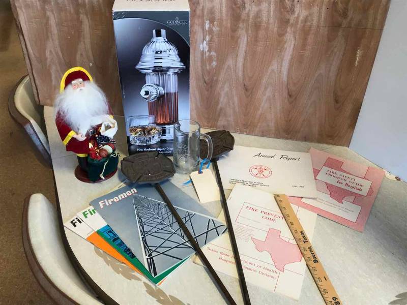 lot 55 image: Fire Department Items Godinger Liquour Decanter, Etched Glass, Manuals, Grave Markers