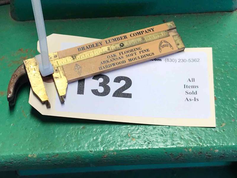 lot 132 image: Measuring Device Thickness, Bradley Lumber Company & a Little Bitty Hammer Head