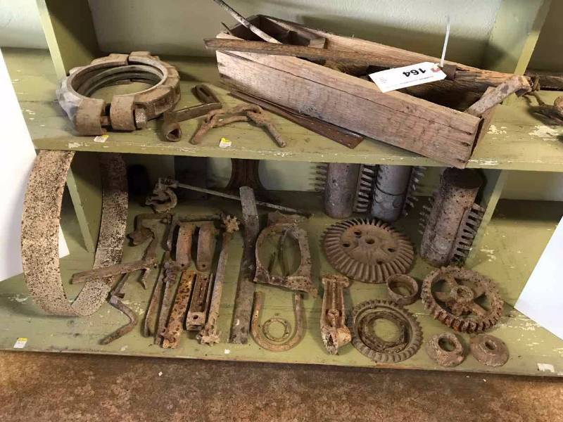 lot 164 image: Old Metal Gears, Rusty Machete, Stove Parts, Pipe Clamp, Other Cool Old Iron Pieces
