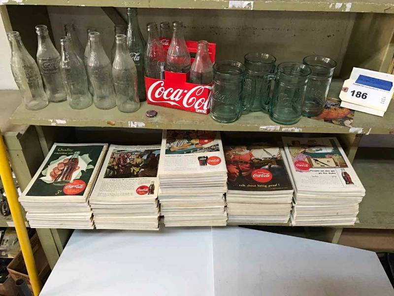lot 186 image: Coca Cola Vintage Marketing Ads on Back of Natl Geographics, Bottles, (4) Mugs