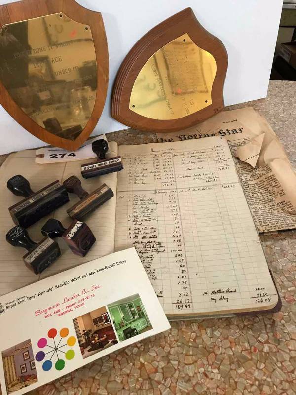 lot 274 image: Bergmann Lumber  Award Plaques, Stamps, Old Store Registry