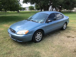 lot 1 image: 2006 Ford Taurus (blue) odometer reads 40,114 (vin 1FAHP53266A263191)
