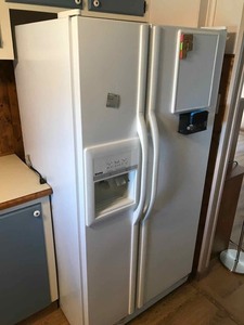 lot 13 image: Kenmore Side by Side Refrigerator Freezer with IceWater in Door, Model 106.50262990. Mfg. 2000.02.