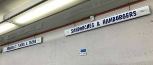 lot 230 image: (2) Signs  Breakfast Plates & Tacos,  Sandwiches & Hamburgers