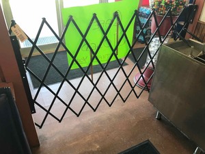lot 241 image: Metal Security Gate-Divider, accordian style, 49 in tall, six feet opening