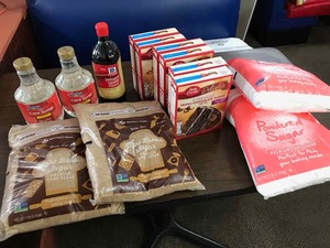 lot 146 image: Unopened Packages Bakery Items  Corn Strup, Brown Sugar, Cakes, Powdered Sugar, Vanilla