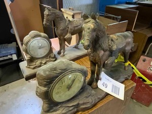lot 49 image: (2) Vintage Horse Cast Horse Clocks (1 has broken tail)