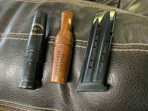 lot 58 image: (2) Calls  Mallard, Green Head Deer and a Walther PPX 9MM 16 Round Mag.