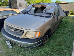 lot 20 image: Storage Lien Wreck  1999 Ford F150 Pickup, brown, Has Keys (VIN 1FTRX17W5XKB76494)