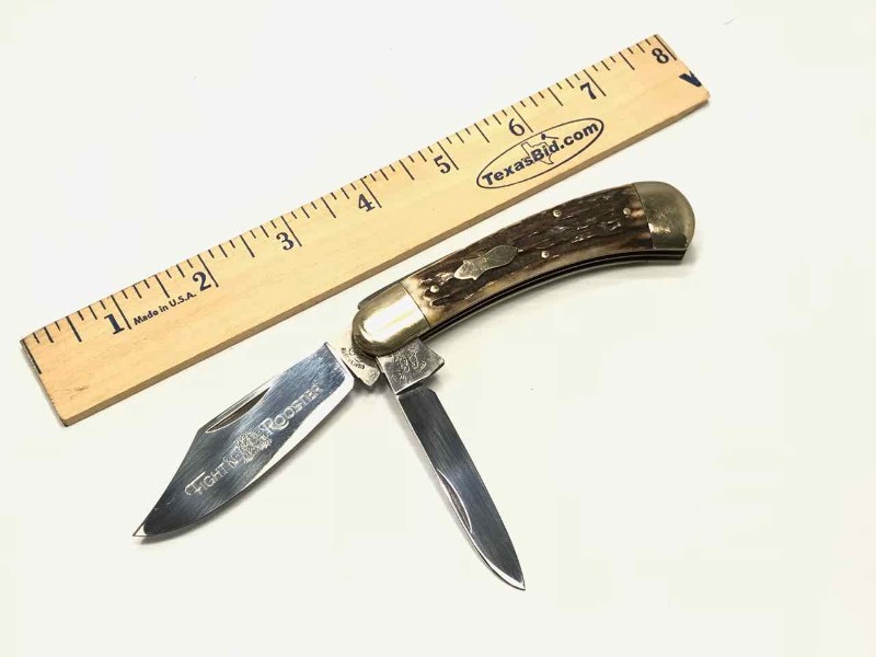 lot 467 image: Fightn Rooster Knife  Frank Buster Celebrated