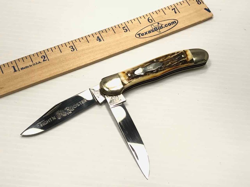 lot 469 image: Fightn Rooster Knife  Frank Buster Celebrated
