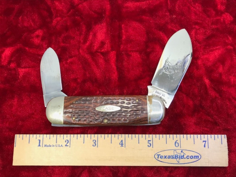 lot 106 image: Knife  Case XX #6250,  (5 dot) Wood handle folding knife, etched with elephant on main blade.  Blade approx. 3 in.