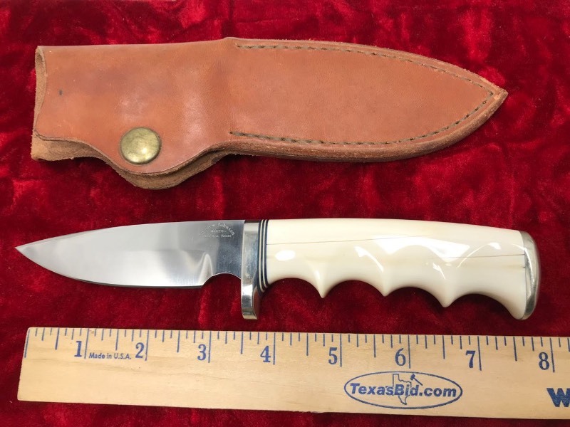 lot 118 image: Custom Knife  Maker Gordon Johnson,  Houston, Texas,  Ivory Finger Grooved Handle (cracked),  approx. 8.25 in. overall, includes sheath