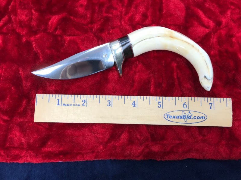 lot 131 image: Custom Knife  Maker Ed Carr of Brazoria, Texas. 3-14in. Blade 6-34in. OA Marked #3 Warthog Tusk & Water Buffalo Spacer