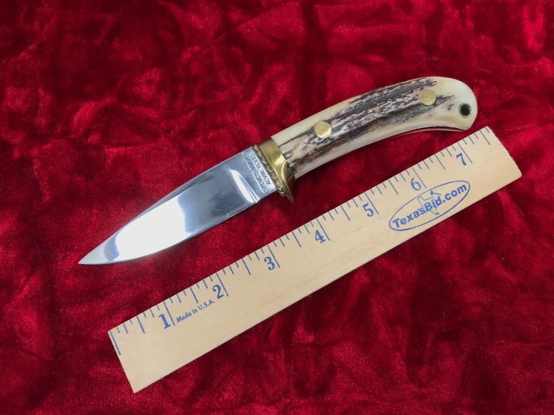 lot 135 image: Custom Knife  Steve Davenport, an early Texas maker, 1970s, Sambar Stag, Droppoint Hunting Knife Mark B57 79 (pitting on blade)