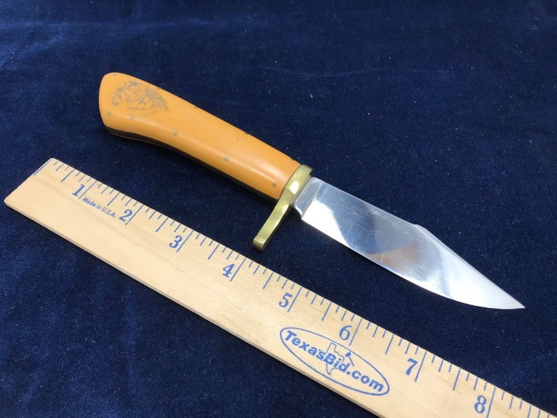 lot 157 image: Knife  Unmarked Custom with Scrimshaw Micarta Handle, Scrimshaw Lion