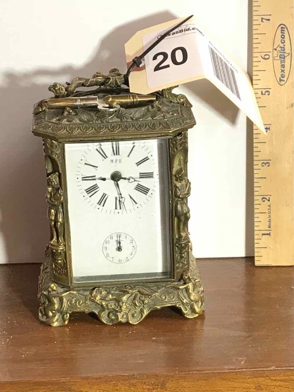lot 20 image: Clock  Brass, M.F.E.