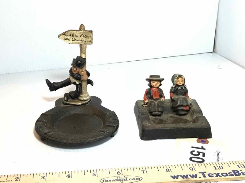 lot 150 image: (2) Cast Iron Ash Trays Dutch Boy & Girl,  Bourbon Street