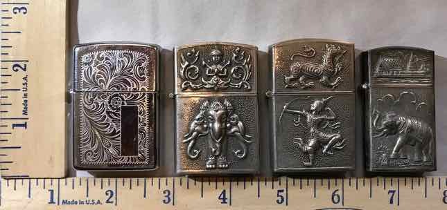 lot 472 image: (4) Lighters (3) Silverstar, (1) Zippo