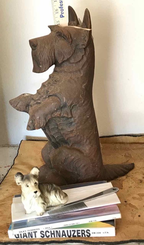 lot 609 image: Cast Iron ScottieWestie Dog Door Stop, Pottery Figurine & (2) Books