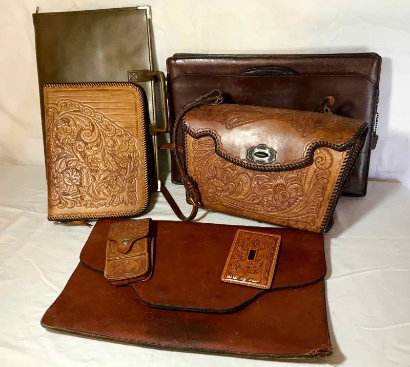 lot 257 image: Tooled Leather Items Purse, Notebook Cover, Phone Case, Light Switch Cover and (2) Asst. Portfolios