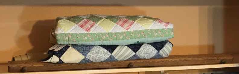 lot 366 image: (2) Quilted  Lap Throw, Bed Spread, Wood Holder