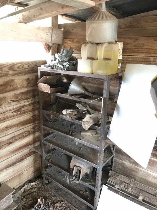 lot 821 image: Metal Shelf with Hangers, Funnels, Saddle Parts