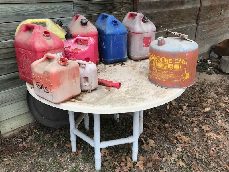 lot 834 image: Table & Gas Cans