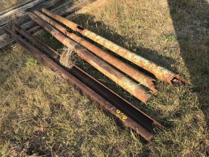 lot 909 image: (2) Railroad Iron Rails, Pipes