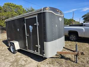 lot 15 image: 2004 Haulmark Transport DLK Model TS6X12DS2 Motorcycle Trailer, has floor tie-downs, ramp door and side door  (VIN  16HCB12164G063837)