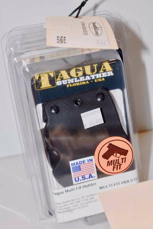 lot 596 image: (3)Tagua Holsters