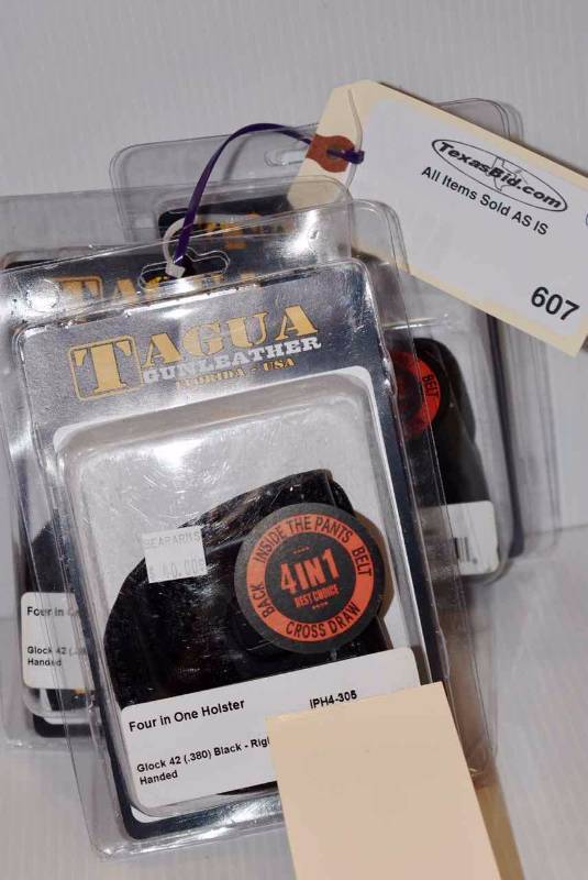 lot 607 image: (3)Tagua Holsters