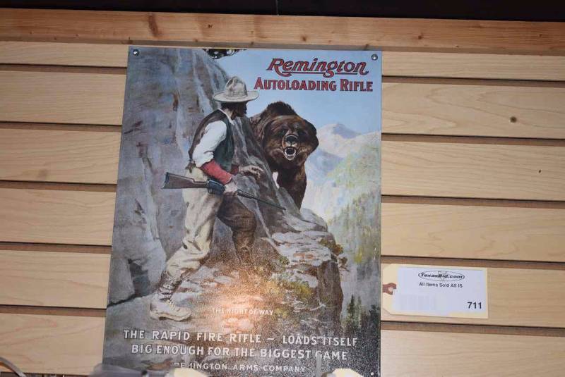 lot 711 image: Tin Sign Remington Bear