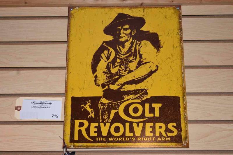 lot 712 image: Tin Sign Colt Revolvers