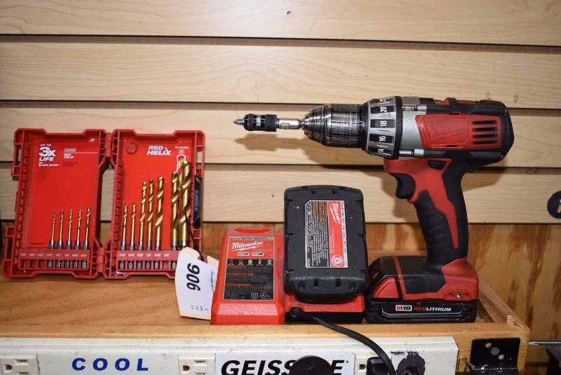 lot 906 image: Milwaukee Drill, Bits, Charger, Battery