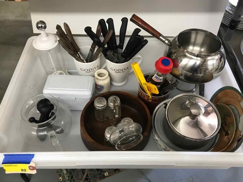 lot 82 image: Kitchen Assortment  Fondue Pot, Steak Knives, Salt & Peppers, Nut Cracker with Bowl, Storage Bowls, Cups, Plastic Tub