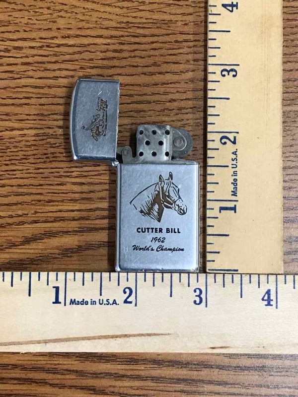 lot 184 image: Vintage Zippo Lighter  1962 Cutter Bill Worlds Champion, Good Luck Cauble Ranch