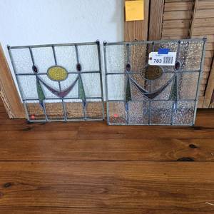 lot 783 image: (2) stained glass panels (square, drape, yellow oval center)