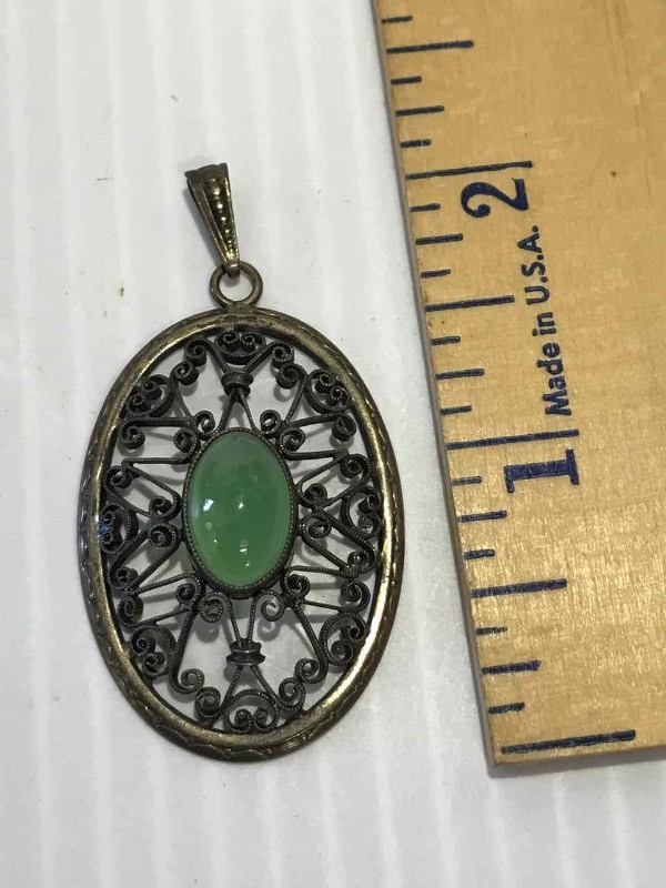 lot 52 image: Oval Pendant with Green Stone