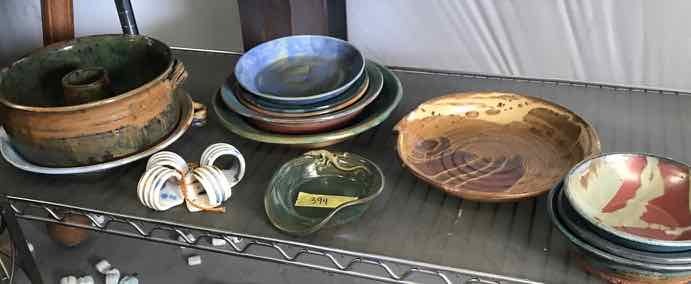 lot 394 image: (16) Asst. Pottery Pieces  Spoon Rest with Lizard, Bowls, Plates, Napkin Rings, Etc.