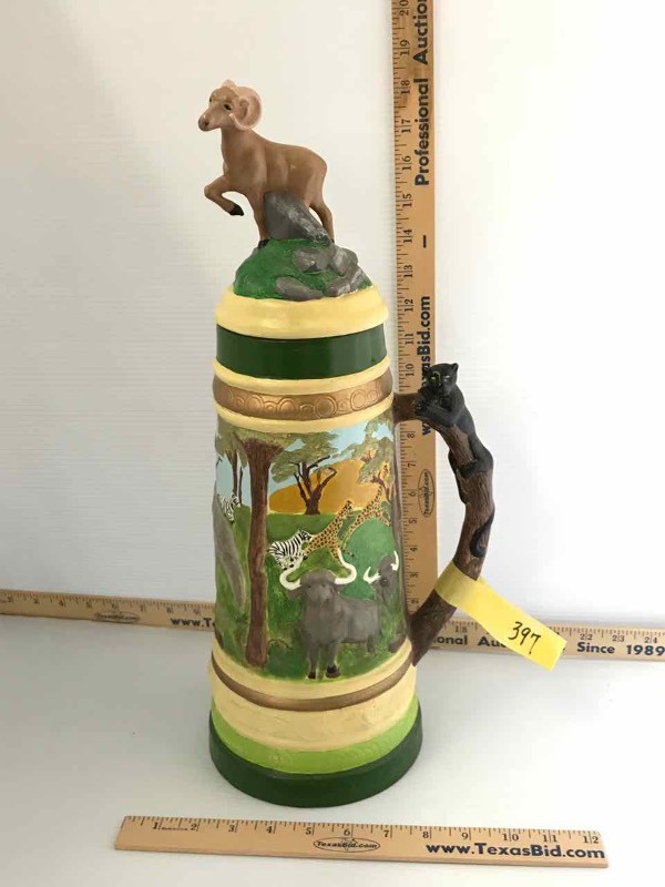 lot 397 image: Tall Ceramic Stein with Animals